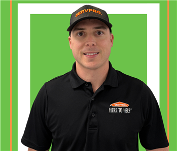 A SERVPRO employee is shown in a black shirt