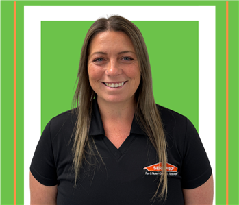 A SERVPRO employee is shown in a black shirt with SERVPRO logo