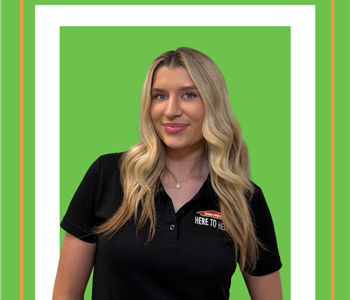 A SERVPRO employee is shown in a black shirt with SERVPRO logo